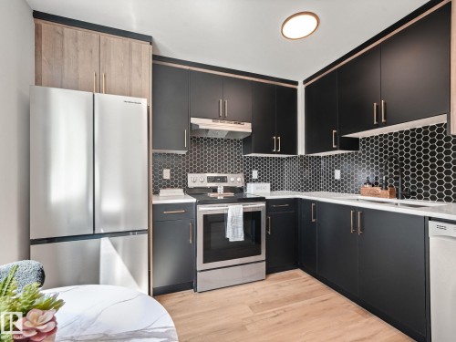 #10 13833 30 St Nw, Edmonton, AB - Indoor Photo Showing Kitchen With Stainless Steel Kitchen