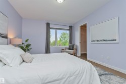Vinyl plank flooring, and a large window with privacy coverings and a nice view of the tranquil park. - 