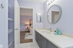Double vanity with integrated sinks and a light-toned countertop - 