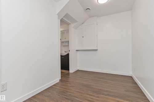 Vinyl plank flooring with room for an office! - 4121 Tompkins Way Nw, Edmonton, AB - Indoor Photo Showing Other Room