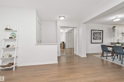 Vinyl flooring, white walls, and ample dining room space - 