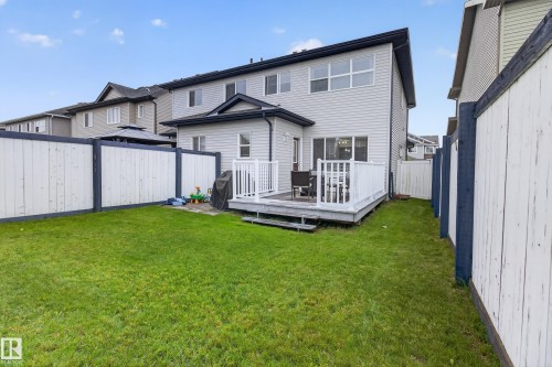 Expansive green lawn with privacy fencing and a rear deck - 17305 73 Street Nw, Edmonton, AB - Outdoor With Deck Patio Veranda With Exterior