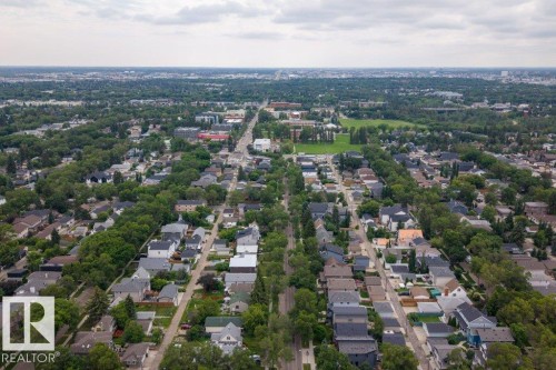 Aerial perspective of a residential neighborhood with tree-lined streets and varied architectural styles - 9026 92 Street Nw, Edmonton, AB - Outdoor With View