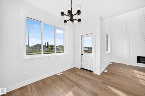 77 Elliott Wynd, Fort Saskatchewan, AB - Indoor Photo Showing Other Room With Fireplace