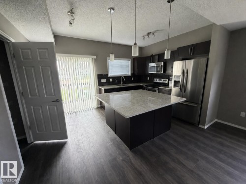 Photos digitally enhanced - #21 6520 2 Av Sw, Edmonton, AB - Indoor Photo Showing Kitchen With Upgraded Kitchen