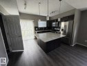 Photos digitally enhanced - #21 6520 2 Av Sw, Edmonton, AB  - Indoor Photo Showing Kitchen With Upgraded Kitchen 