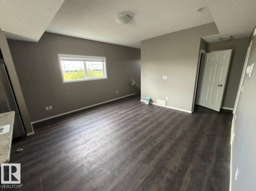 Photos digitally enhanced - #21 6520 2 Av Sw, Edmonton, AB - Indoor Photo Showing Other Room