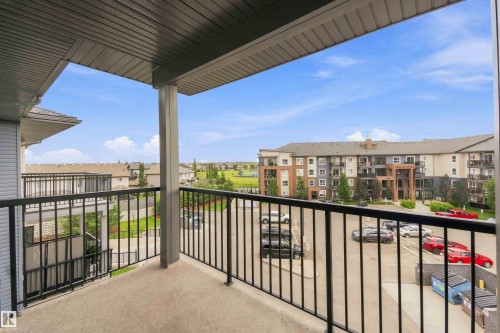 Private balcony featuring a concrete floor and black metal railing - #414 5510 Schonsee Dr Nw, Edmonton, AB - Outdoor With Exterior