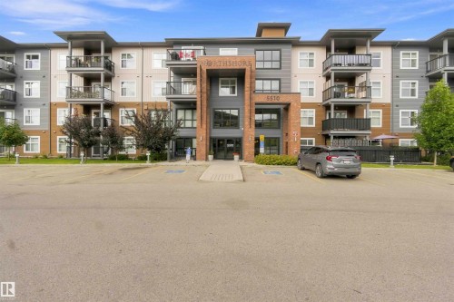 Modern multi-story building featuring a brick and panel exterior - #414 5510 Schonsee Dr Nw, Edmonton, AB - Outdoor With Facade