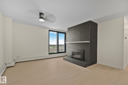 #1408 10125 109 St Nw, Edmonton, AB - Indoor Photo Showing Other Room With Fireplace