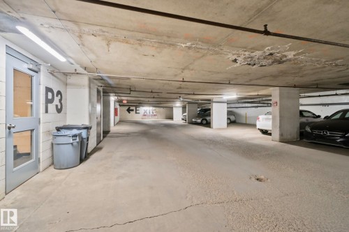 Titled parking stall close to the elevator - #1408 10125 109 St Nw, Edmonton, AB - Indoor Photo Showing Garage