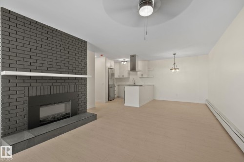 #1408 10125 109 St Nw, Edmonton, AB - Indoor Photo Showing Living Room With Fireplace