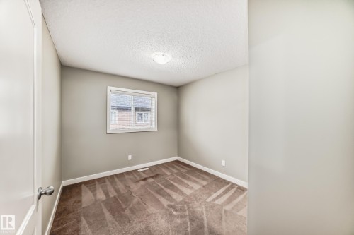 #47 12004 22 Av Sw, Edmonton, AB - Indoor Photo Showing Other Room