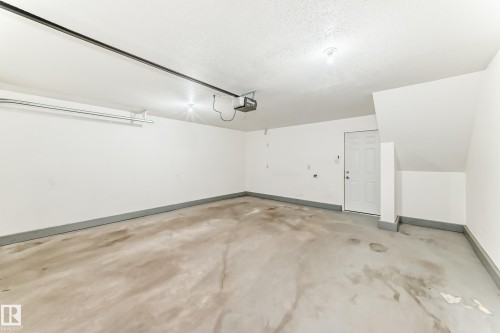 #47 12004 22 Av Sw, Edmonton, AB - Indoor Photo Showing Garage