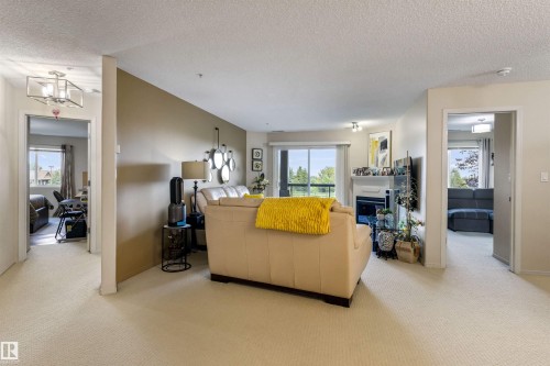 #233 279 Suder Greens Dr Nw, Edmonton, AB - Indoor With Fireplace