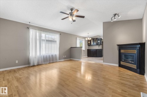 856 53222 Range Road 272, Rural Parkland County, AB - Indoor Photo Showing Living Room With Fireplace
