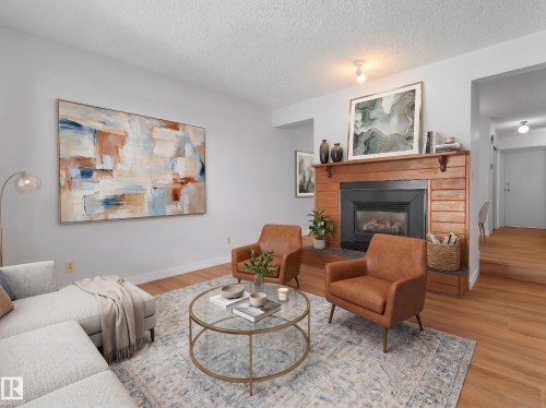 #50 1904 48 St Nw, Edmonton, AB - Indoor Photo Showing Living Room With Fireplace