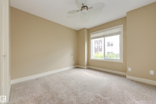 Primary bedroom with walk-in closet - #39 804 Welsh Dr Sw, Edmonton, AB - Indoor Photo Showing Other Room