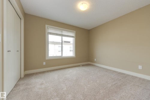 Generous sized second bedroom - #39 804 Welsh Dr Sw, Edmonton, AB - Indoor Photo Showing Other Room
