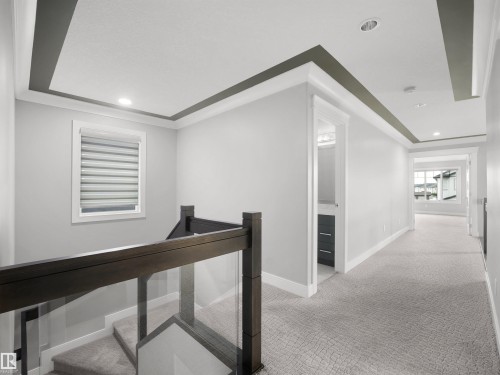 Upper hallway featuring recessed lighting, tray ceiling, and carpet flooring - 17020 62 Street Nw, Edmonton, AB - Indoor Photo Showing Other Room