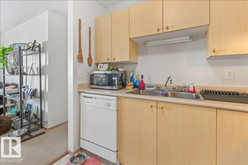 #106B 114 Westpark Dr, Fort Saskatchewan, AB - Indoor Photo Showing Kitchen With Double Sink