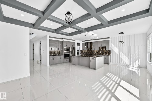 Gray coffered ceiling with recessed lighting - 3101 Soleil Boulevard, Beaumont, AB - Indoor Photo Showing Other Room