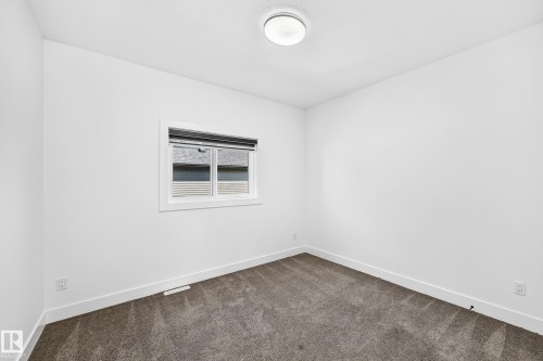 Neutral wall finishes - 3101 Soleil Boulevard, Beaumont, AB - Indoor Photo Showing Other Room