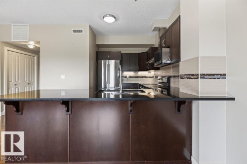 #303 35 Sturgeon Rd, St. Albert, AB - Indoor Photo Showing Kitchen With Stainless Steel Kitchen With Double Sink With Upgraded Kitchen