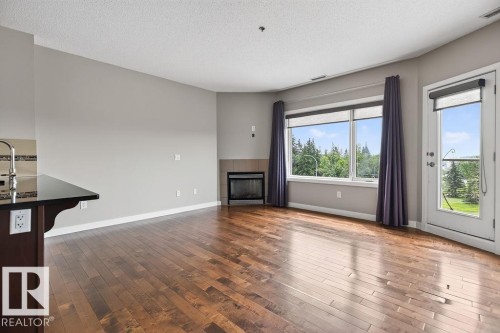 #303 35 Sturgeon Rd, St. Albert, AB - Indoor Photo Showing Other Room With Fireplace