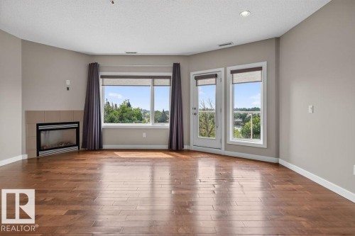 #303 35 Sturgeon Rd, St. Albert, AB - Indoor Photo Showing Living Room With Fireplace