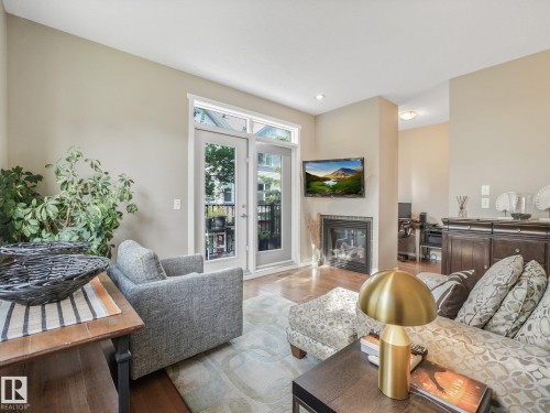 #55 603 Watt Bv Sw, Edmonton, AB - Indoor Photo Showing Living Room With Fireplace