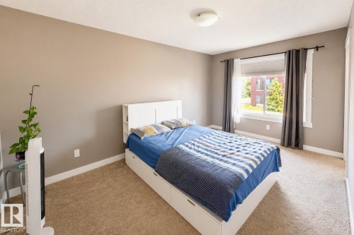 711 57 St Sw, Edmonton, AB - Indoor Photo Showing Bedroom