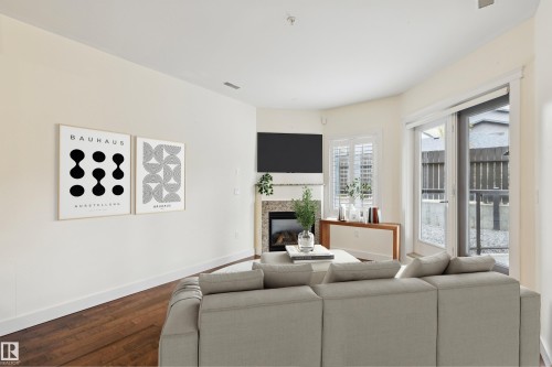 #16 11518 76 Av Nw, Edmonton, AB - Indoor Photo Showing Living Room With Fireplace