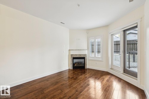 #16 11518 76 Av Nw, Edmonton, AB - Indoor Photo Showing Living Room With Fireplace