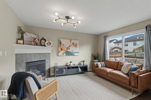 1135 177 Street Sw, Edmonton, AB - Indoor Photo Showing Living Room With Fireplace