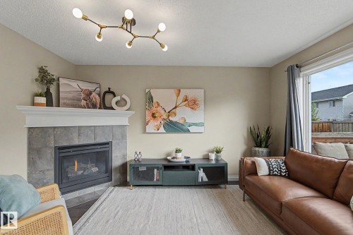 1135 177 Street Sw, Edmonton, AB - Indoor Photo Showing Living Room With Fireplace