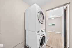 Stacked white laundry appliances - 