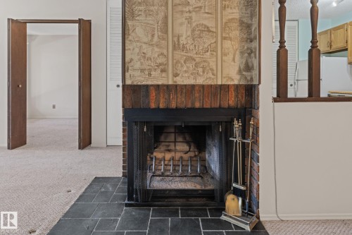 164 Surrey Gardens Nw, Edmonton, AB - Indoor Photo Showing Other Room With Fireplace