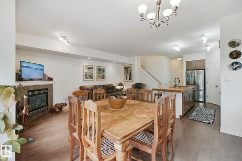 56 Hartwick Manor, Spruce Grove, AB - Indoor Photo Showing Dining Room With Fireplace