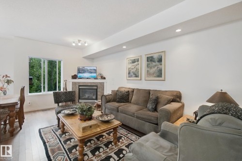 56 Hartwick Manor, Spruce Grove, AB - Indoor Photo Showing Living Room With Fireplace