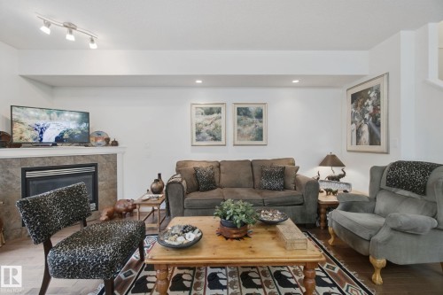 56 Hartwick Manor, Spruce Grove, AB - Indoor Photo Showing Living Room With Fireplace