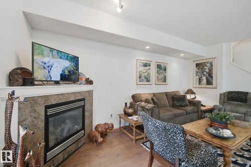 56 Hartwick Manor, Spruce Grove, AB - Indoor Photo Showing Living Room With Fireplace