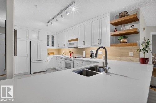 #300 7839 96 St Nw, Edmonton, AB - Indoor Photo Showing Kitchen With Double Sink