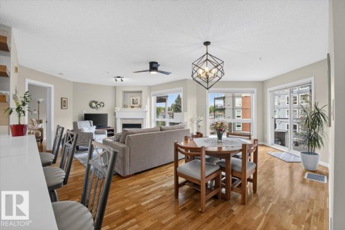 #300 7839 96 St Nw, Edmonton, AB - Indoor Photo Showing Dining Room With Fireplace
