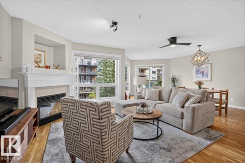 #300 7839 96 St Nw, Edmonton, AB - Indoor Photo Showing Living Room With Fireplace