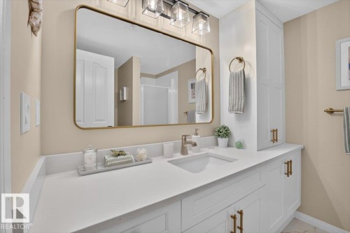 Renovated with taste and quality....Quartz counters, high end cabinets, Kohler fixtures...NICE!! - #300 7839 96 St Nw, Edmonton, AB - Indoor Photo Showing Bathroom