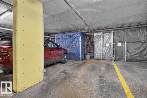 Close to the elevator with secured storage in front of the stall  #17 - #300 7839 96 St Nw, Edmonton, AB - Indoor Photo Showing Garage
