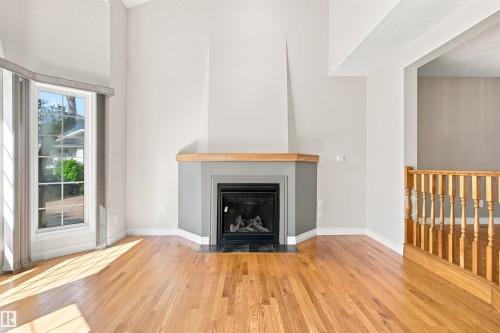 #1 3311 58 St Nw, Edmonton, AB - Indoor Photo Showing Living Room With Fireplace