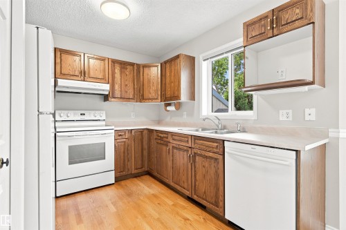 #1 3311 58 St Nw, Edmonton, AB - Indoor Photo Showing Kitchen With Double Sink