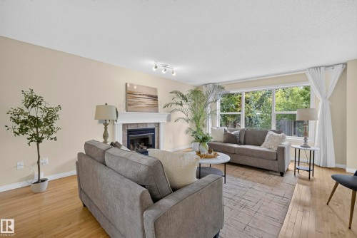 1322 Barnes Close Sw, Edmonton, AB - Indoor Photo Showing Living Room With Fireplace